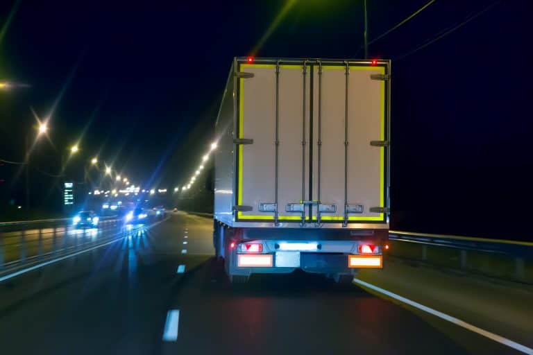 truck moves on country highway at night